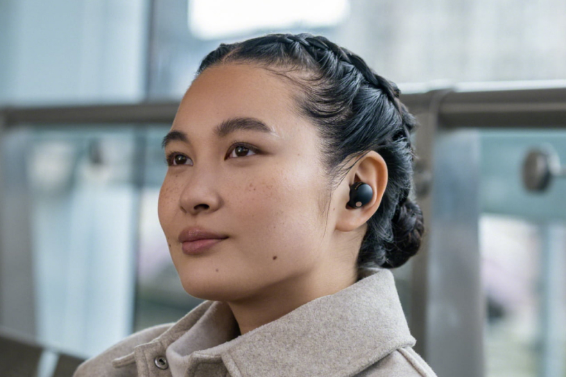 woman with Sony earbuds